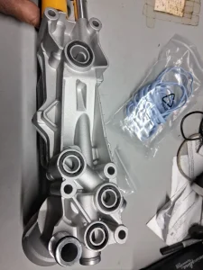 The product is a 2011 to 2016 aluminum oil filter housing complete with seals and switch filter gaskets. It is designed for easy installation and made with rubber gasket material. This oil filter housing is a crucial component for maintaining the engine of a vehicle, providing a secure seal to prevent leaks and ensure optimal filtration. The included gaskets and seals ensure a complete and proper fit, making it a reliable choice for automotive maintenance and repai